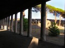 Grande Palestra * The Grand Palestra, as viewed through the surrounding columns.  The open area in the center was used for training the atheletes and included a huge swimming pool in the middle of the area.  In the background the amphitheater is visible. * 432 x 323 * (53KB)